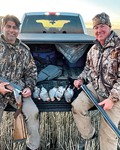 Manak and Rick with a nice harvest of Hungarian partridge.