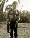 The author, age 9, 1962, with supper.”